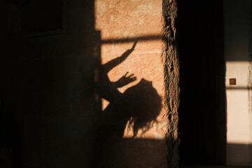Shadow of a woman dancing