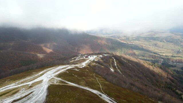aerial view of travel landmark autumn mountains with snow
