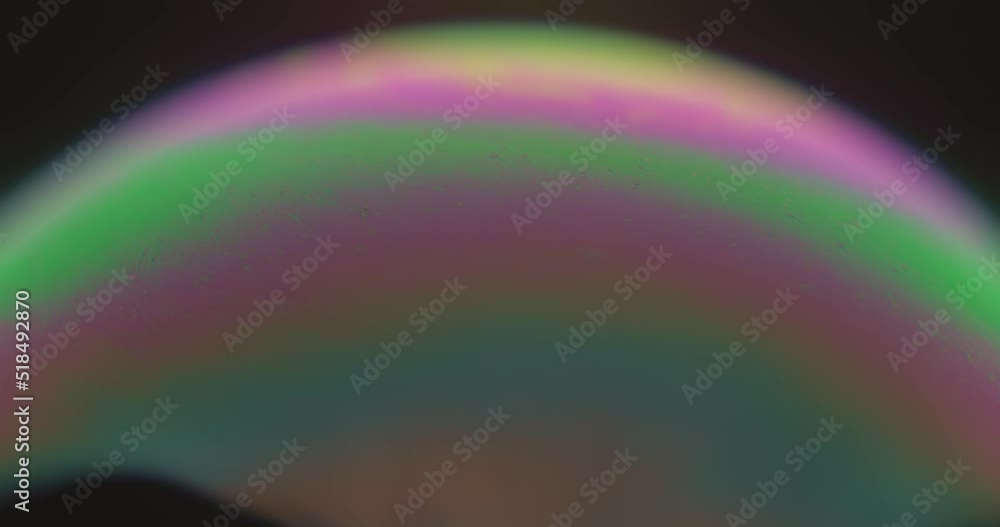 Aufkleber macroscopic view of soap bubble showing colorful and bright layers. close up.