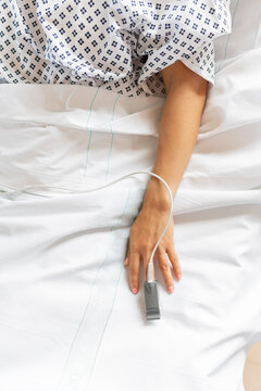 Unrecognizable patient Lying In hospital room