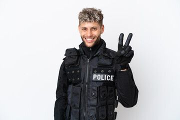 SWAT caucasian man isolated on white background smiling and showing victory sign