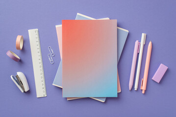 School supplies concept. Top view photo of stylish gradient color diary pens adhesive tape stapler...