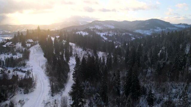 aerial view of sunrise above winter carpathian mountains