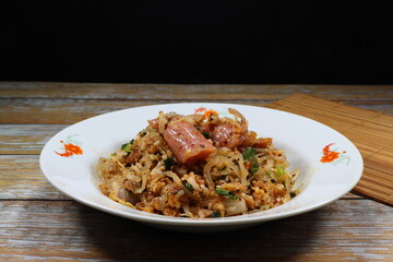 Traditional spicy sour pork mixed with roasted peanut and herbal vegetable. Famous street food menu in Thai restaurant.