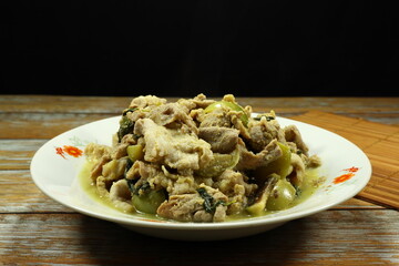 Traditional green curry, spicy pork meat and green eggplant mixed with coconut milk. Famous menu in Asia restaurant.