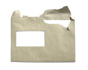 Torn envelope paper with white letter visible