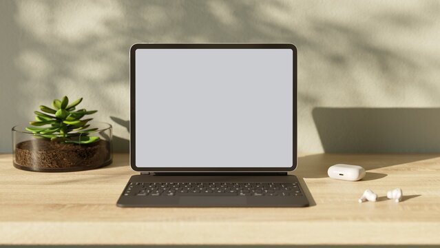 Tablet pc with blank screen on wood table. Aesthetic workplace.  