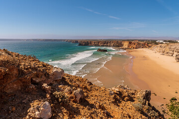 View from the cliffs of the beach and the Atlantic Ocean in Sagres on the west coast of Portugal.