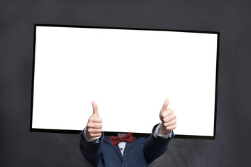 Happy boy in suit with blank empty screen display tv-head showing thumb up on black background