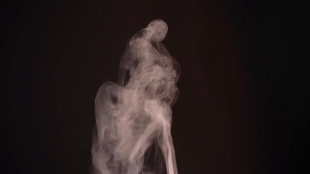 White smoke, fog, mist, vapor on a black background.