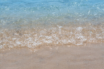 Fototapeta na wymiar Beautiful view of sea wave on sandy shore