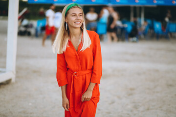 Happy woman in red dress on a vacation