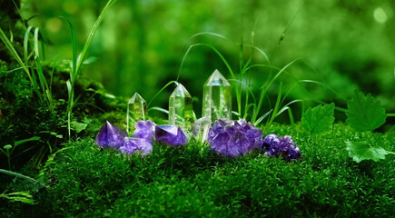 Crystals close up on moss, mysterious dark natural blurred background. set of amethyst and clear...