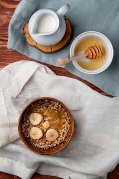 Muesli breakfast with babanas and honey