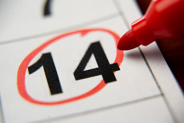 The calendar 14th day of the month is circled. A red marker circles the fourteenth day of the month...