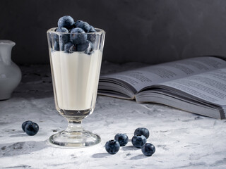 Fresh and wet blueberries and youghurt