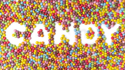 word CANDY. Multi-colored round candies on white backgrounds.
