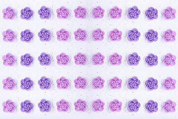 正月　紫とピンクの水引と和紙のデザインの合成（金銀振の白い和紙の背景）