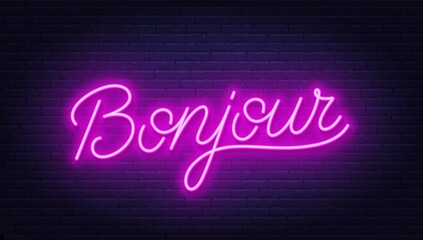 Bonjour neon sign on brick wall background.