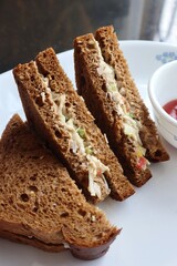 Healthy Chicken mayonnaise sandwich served with Tomato ketchup. homemade multigrain brown bread. Copy space.