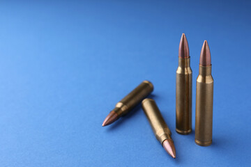 Bullets on blue background, closeup. Space for text