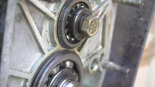 Metal bearing rotation, close-up.Gearbox housing with bearings and gears. The bearings rotate in the crankcase.