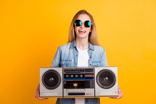 Photo of girl hold boom box wear yellow youth style clothes isolated over color background