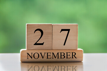 November 27 calendar date text on wooden blocks with copy space for ideas or text. Copy space