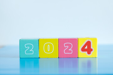 New year concept. Colorful wooden blocks displaying the year of 2024 isolated on white background with copy space for text. 