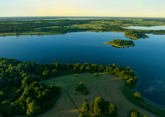 Lake in morning mist sunrise. Rural landscape. Lake mist haze. Countryside at dawn in fog, drone view. Lake in Foggy dawn. Pond in dusk at rural fog landscape. Drink water safe. Global drought crisis.