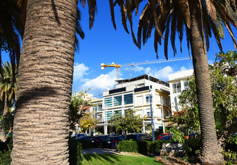 Construction of luxury housing and apartments near coastline of the sea. Tower crane on the...