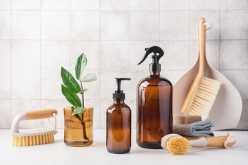 Zero waste aesthetic, housekeeping  cleaning equipment. Eco detergents in glass bottles, brushes,...