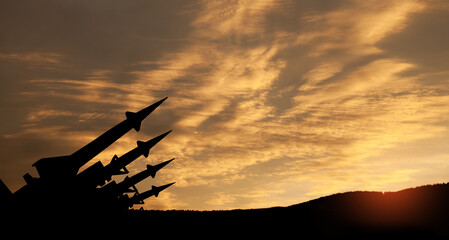 The missiles are aimed at the sky at sunset. Nuclear bomb, chemical weapons, missile defense, a...
