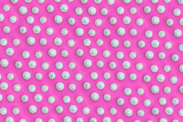 Sweet meringue, marshmallow, candies wallpaper background, pattern. Bright backdrop for design. Noisy surface texture