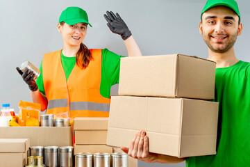 Help Collection Center, free food distribution. Volunteers wearing uniform green caps, t-shirts,...