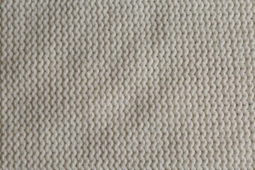 Beautiful white knitted fabric as background, top view
