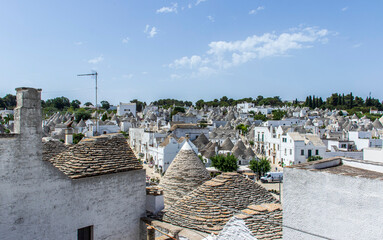 Obraz premium The trulli, typical limestone houses of Alberobello in southern Puglia, Italy, are extraordinary examples of dry stone slab construction, a technique dating back to prehistoric times and still used