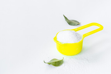 White washing powder with measuring scoop. Laundry day concept