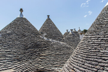 Fototapeta na wymiar The trulli, typical limestone houses of Alberobello in southern Puglia, Italy, are extraordinary examples of dry stone slab construction, a technique dating back to prehistoric times and still used