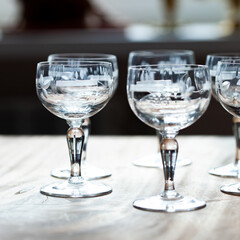 antique transparent glass set of wine glasses in luxury interior. crystal glass with engraving. glass 