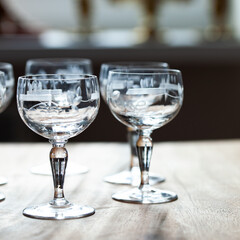 antique transparent glass set of wine glasses in luxury interior. crystal glass with engraving. glass 