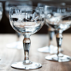 antique transparent glass set of wine glasses in luxury interior. crystal glass with engraving. glass 