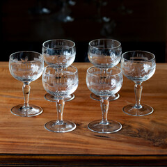 antique transparent glass set of wine glasses in luxury interior. crystal glass with engraving. glass 