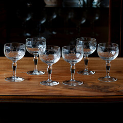 antique transparent glass set of wine glasses in luxury interior. crystal glass with engraving. glass 