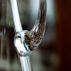 glass antique decanter in luxury interior. crystal clear wine decanter. bohemian glass closeup