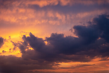 Beautiful evening cloudy sky. Pink warm clouds at sunset. colorful background