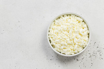 Cottage cheese in a bowl. Top view, copy space, flat lay.