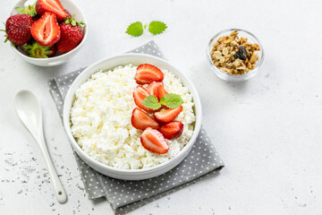 Fresh strawberry cottage cheese granola bowl. Top view, copy space, flat lay.