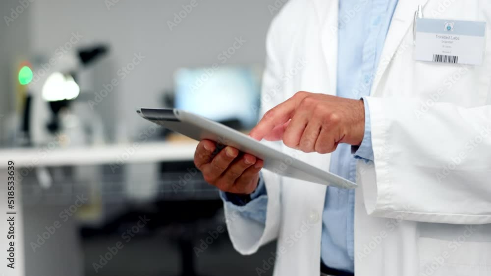 Poster One scientist doing research on a digital tablet online while working at a laboratory alone. Medical researcher or doctor browsing online and searching the internet for information on science