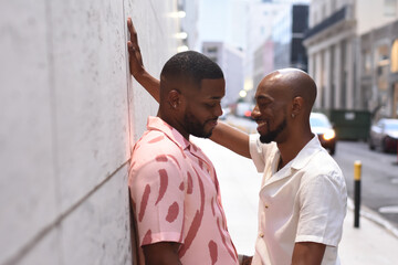 USA, Louisiana, Smiling gay couple flirting in city